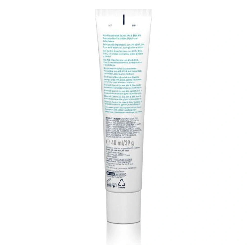 The back of a white squeeze tube for a skincare product, featuring blue and black text, photographed on a solid white background.