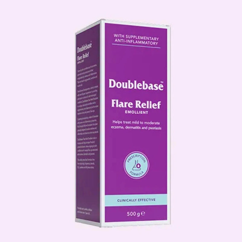 Doublebase Flare Relief Emollient 500g box packaging, featuring a purple and white design with a light blue accent band, set against a pale lavender background.
