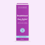 A 500g box of Doublebase Flare Relief Emollient, featuring a purple and white design with a light blue accent band at the bottom, set against a pale lavender background.