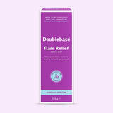 A 500g box of Doublebase Flare Relief Emollient, featuring a purple and white design with a light blue accent band at the bottom, set against a pale lavender background.