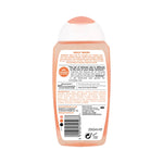 Back view of a skincare product bottle with text and branding on a white background