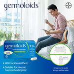 Germoloids suppositories packaging with a man sitting on a couch holding a cup.
