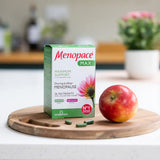 Menopace Max supplement box with an apple on a wooden board