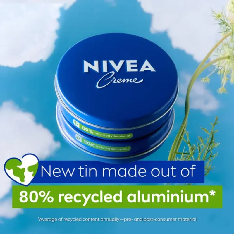 Nivea cream tins with recycled aluminum label against a blue sky background