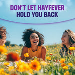 Three women laughing in a field of flowers with text 'Don't Let Hayfever Hold You Back' on a blue background.