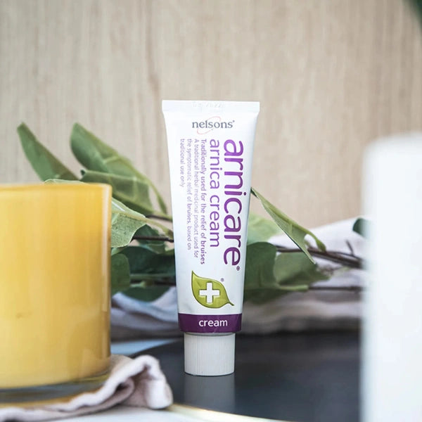 Tube of Arnica Cream with a blurred background