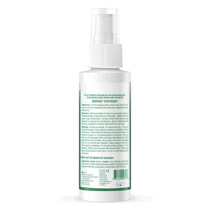 White spray bottle with green label on a white background