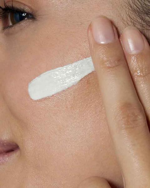 cerave spf 50 moisturizer applying on face skin