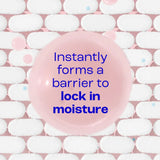 Pink soap bar with text 'Instantly forms a barrier to lock in moisture' on a white and pink background