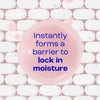 Pink soap bar with text 'Instantly forms a barrier to lock in moisture' on a white and pink background
