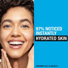 Advertisement for skincare product showing a woman's face with text about instant hydration.
